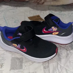 Nike Black and Blue Sneakers with Mesh Upper
