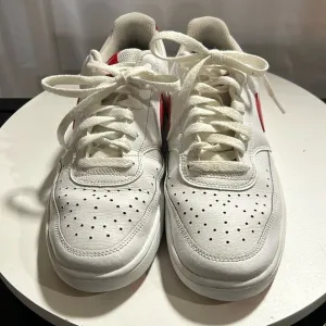 Nike Court Vision Low - DM7588-100 - White/Red/Black Swoosh Print.