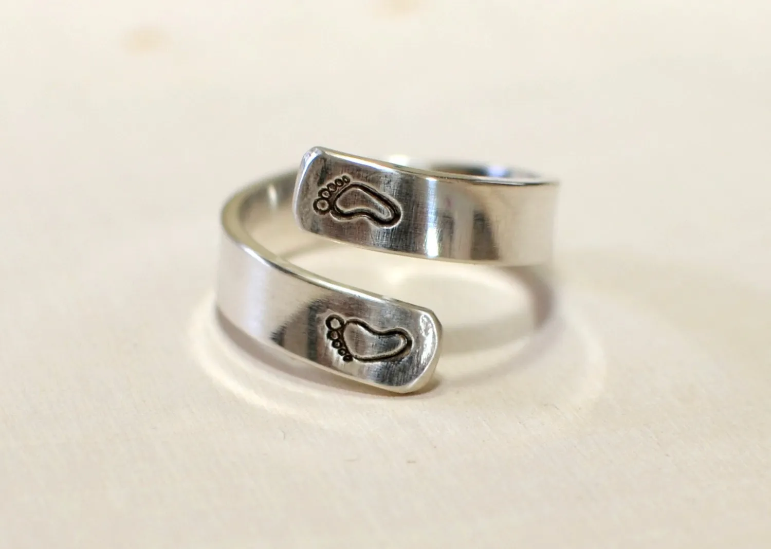 Sterling silver ring for a new mom with babyfeet and birth date