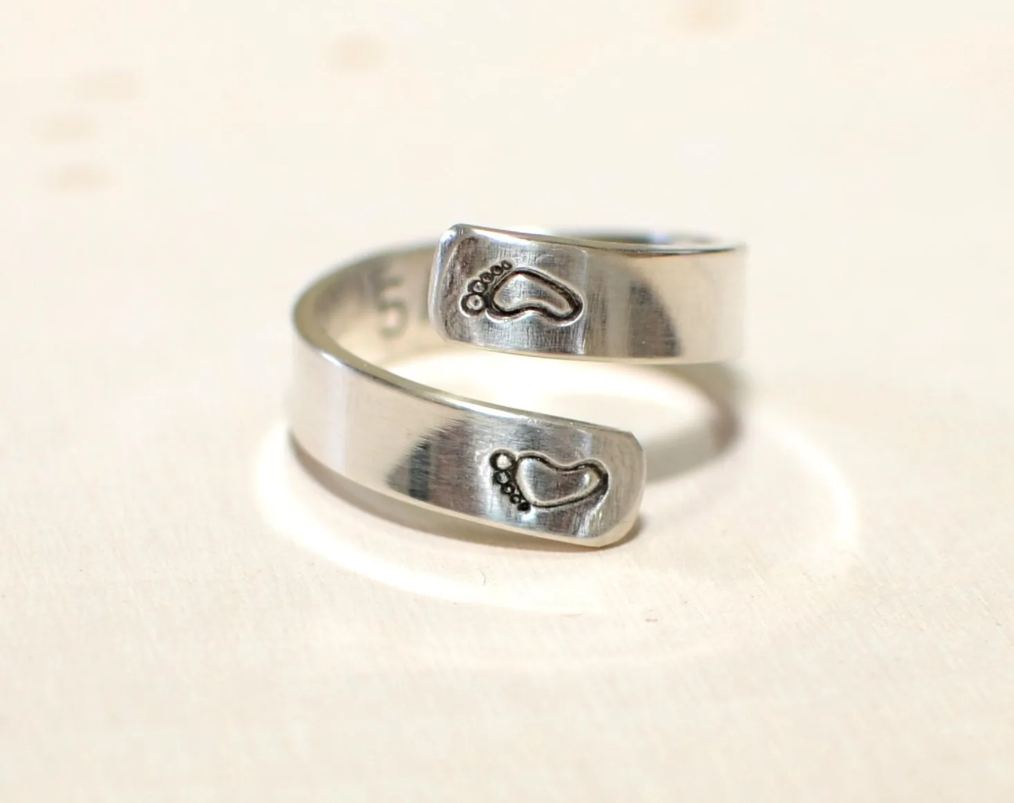 Sterling silver ring for a new mom with babyfeet and birth date